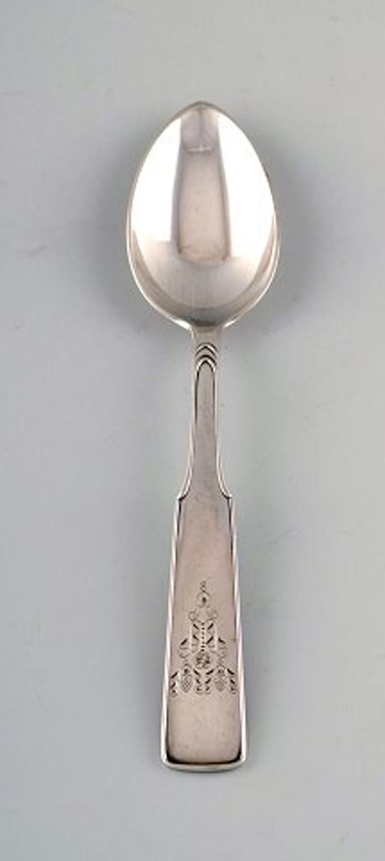 Hans Hansen silverware number 2. 13 dessert spoons in all silver. 
Measures: 18.5 cm.
Perfect condition.
Stamped.
13 pcs in stock