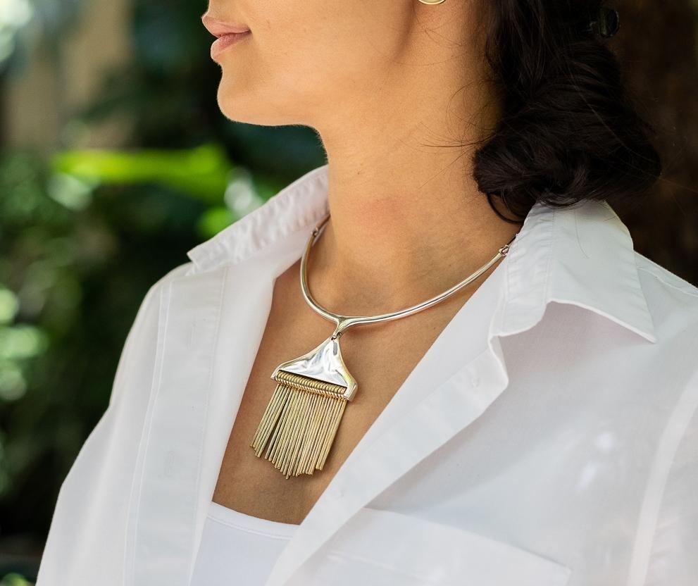 Hans Hansen Sterling Silver Necklace with Pendant by Bent Gabrielsen.

Pendant has Gold Gilt hand-hammer bars and necklace has smooth sterling hinged bars and toggle clasp for comfortable wear.

This rare design can be seen in the permanent