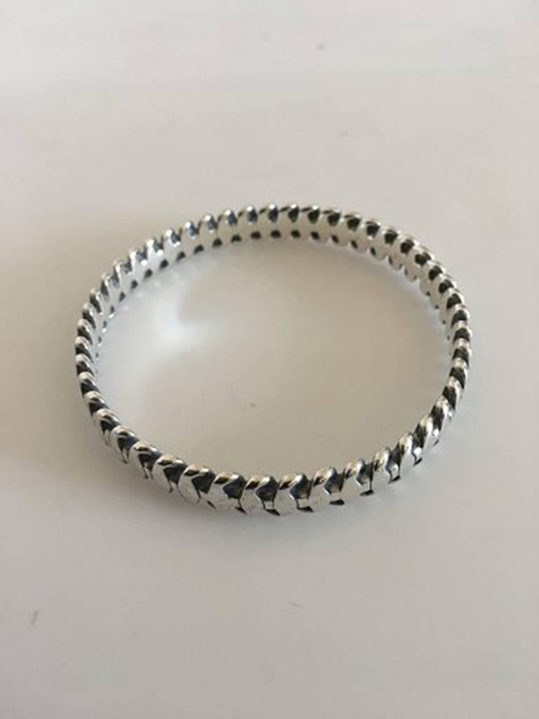 Hans Hansen Sterling Silver Bangle bracelet. Measures 6.2 cm / 2 7/16 in. inner diameter x 0.9 cm / 23/64 in. Weighs 35 g / 1.25 oz.