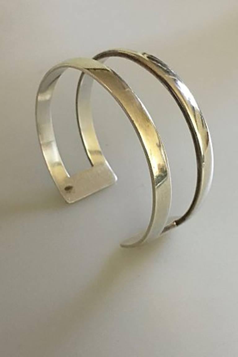 Hans Hansen Sterling Silver Armring. Measures 6 x 5.5 cm dia. 2.5 cm W. Weighs 38 g / 1.30 oz.