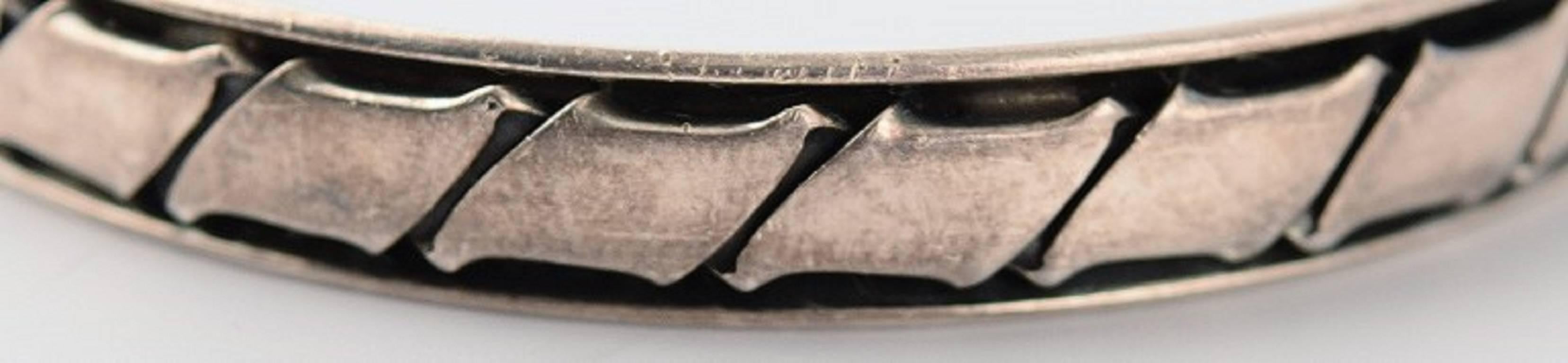 Hans Hansen sterling silver bracelet in modern danish design, number 201. 
6.5 cm. in diameter. In perfect condition.