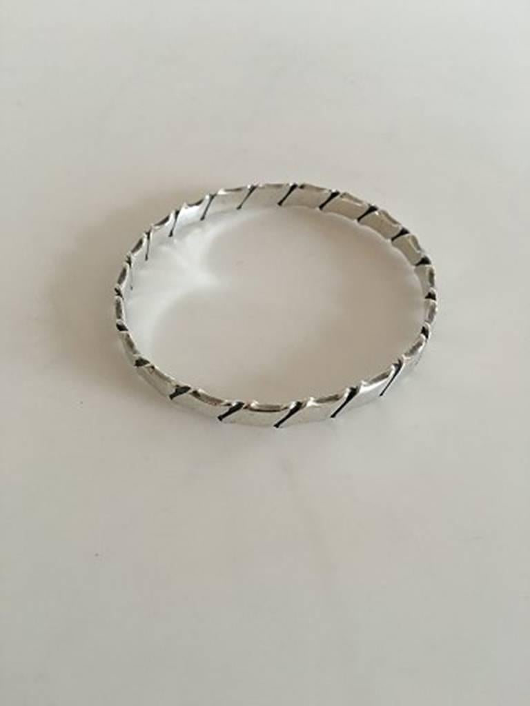 Hans Hansen Sterling Silver Bracelet in Sterling Silver #203. Measures 7 cm and is in good condition. Weighs 27 g / 0.95 oz