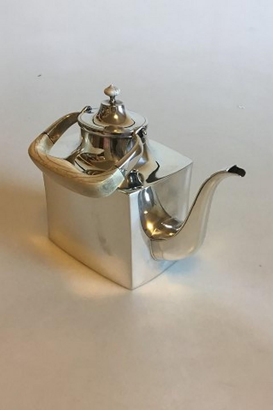 Hans Hansen sterling silver tea pot No 454. From 1972. Measures: 16 cm / 6 19/64 in. Weighs 872 g / 30.80 oz.
Item no.: 349403

Item no.: 336180.