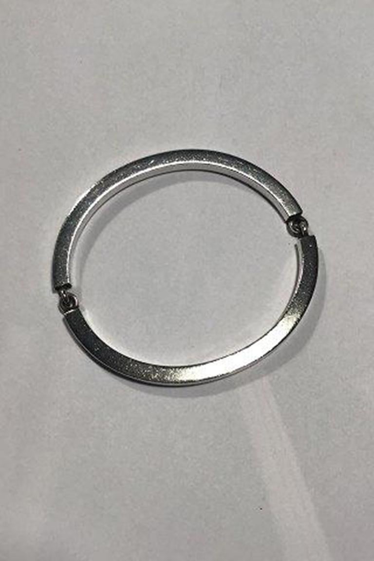 Hans Hansen Sterling Silver Two-part Arm Ring/Bangle.

Inside Diam 6.9 cm (2 23/32 in) Weight 53.8 gr/ 1.89 oz.