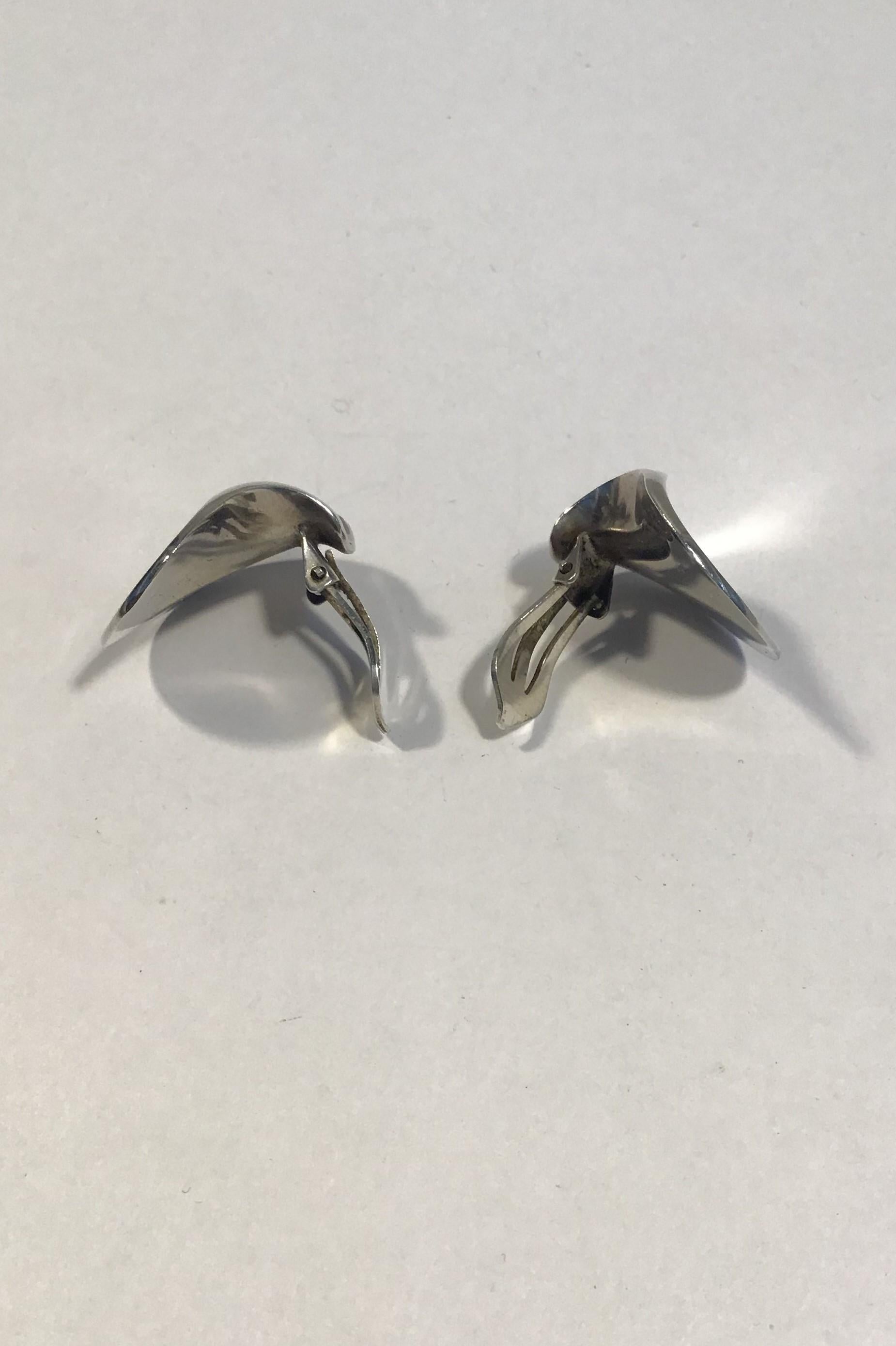 Hans Hansen(Georg Jensen) Sterling Silver Earrings (Clips) 

Measures 2.2 cm x 2.6 cm( 55/64 in x 1 1/32 in) 
Combined Weight 13.2 gr/0.47 oz