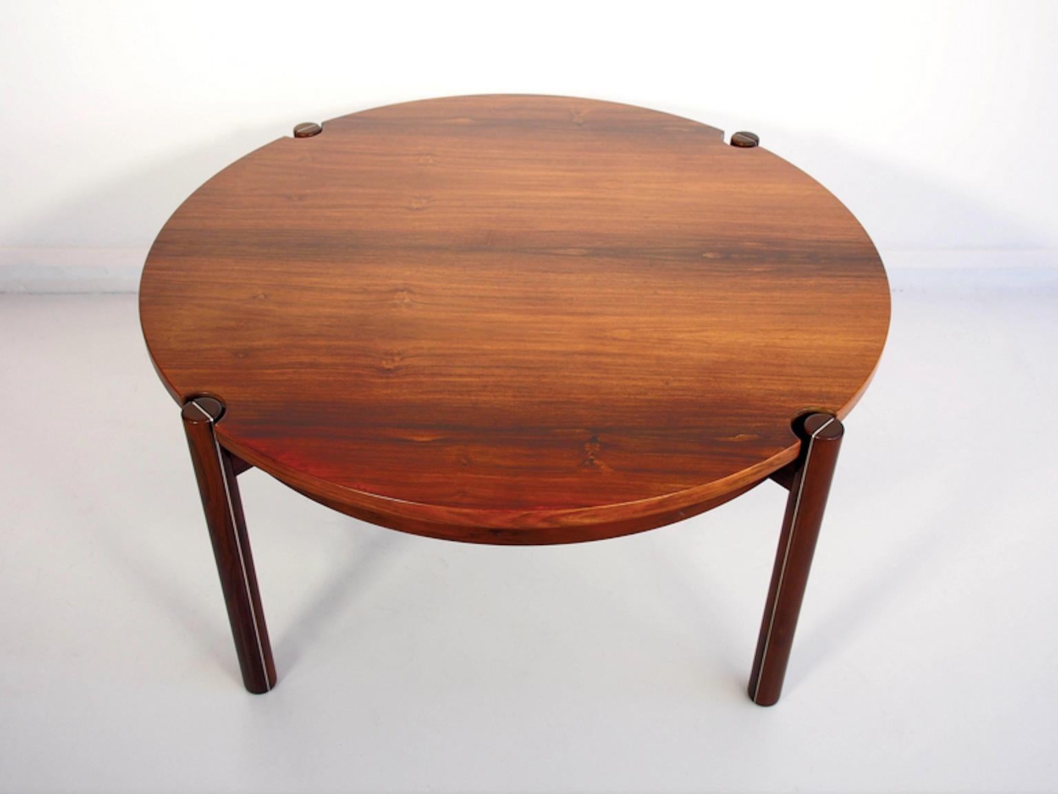 Hans J. Frydendal round hardwood coffee table. Four legs with aluminum details made of solid wood. Minor pressure mark on the table top.