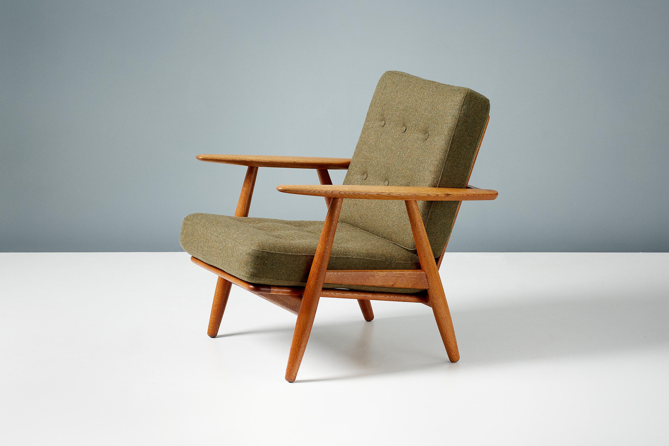 Hans J. Wegner

Pair of GE-240 Cigar chairs, 1955

Produced by GETAMA in Gedsted, Denmark in the 1950s. These examples of Wegner's iconic lounge chair are made from European oak frame with the original sprung cushions reupholstered in fern green