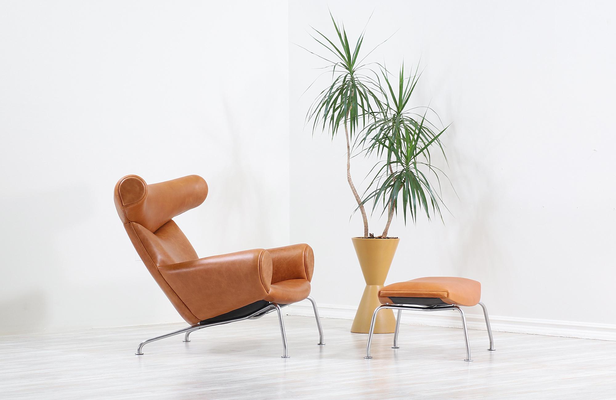 Sculptural modern chair with ottoman model AP-46 designed by Hans J. Wegner for A.P. Stolen in Denmark circa 1960s. This Wegner Classic set epitomizes the designer’s nature ideals and organic aesthetics seen through the blend of quality materials to