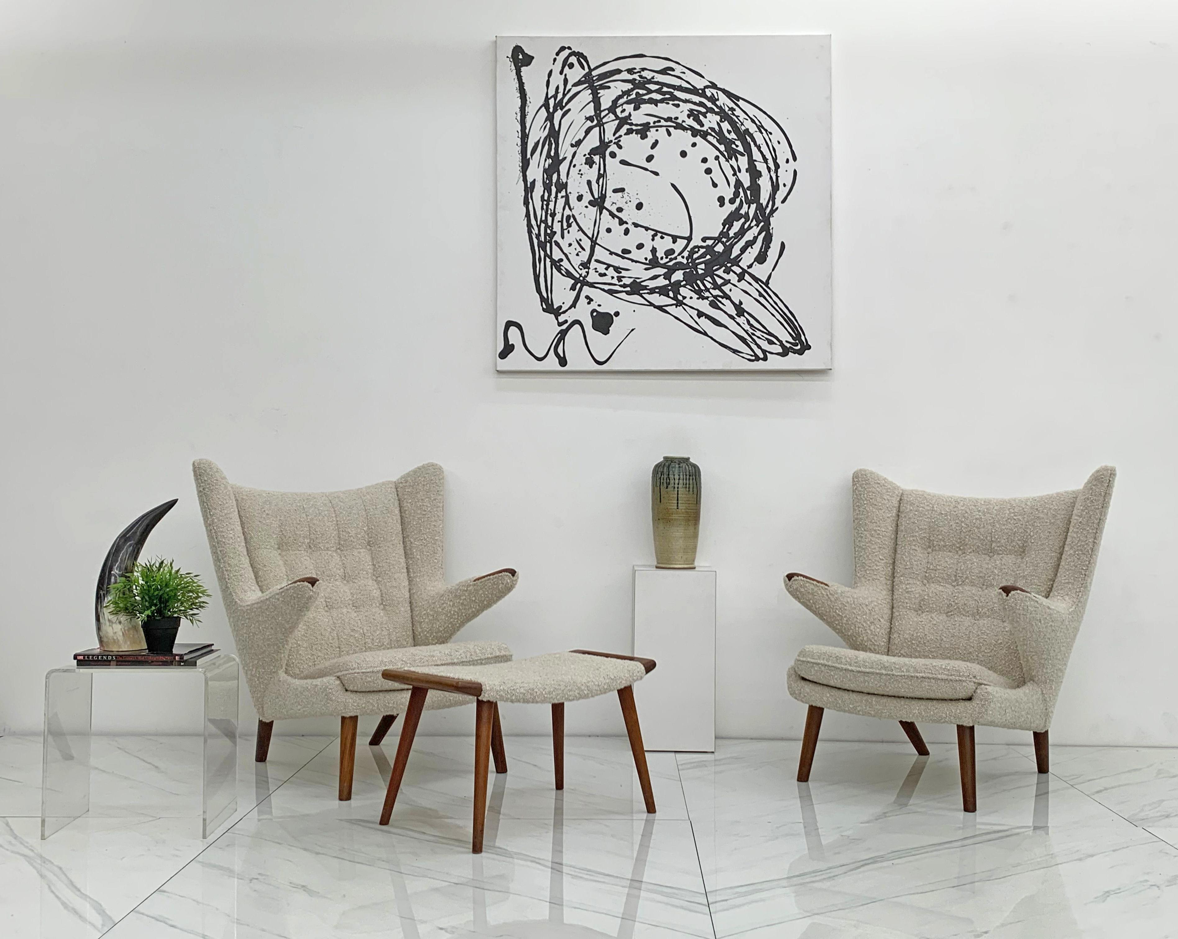 Available now is an absolutely stunning pair of lounge chairs by Hans Wegner for A.P. Stolen, Denmark, 1950's. A truly iconic chair, Hans Wegner designed in 1951 for A.P Stolen. These chairs are quite substantial and are upholstered in a fine