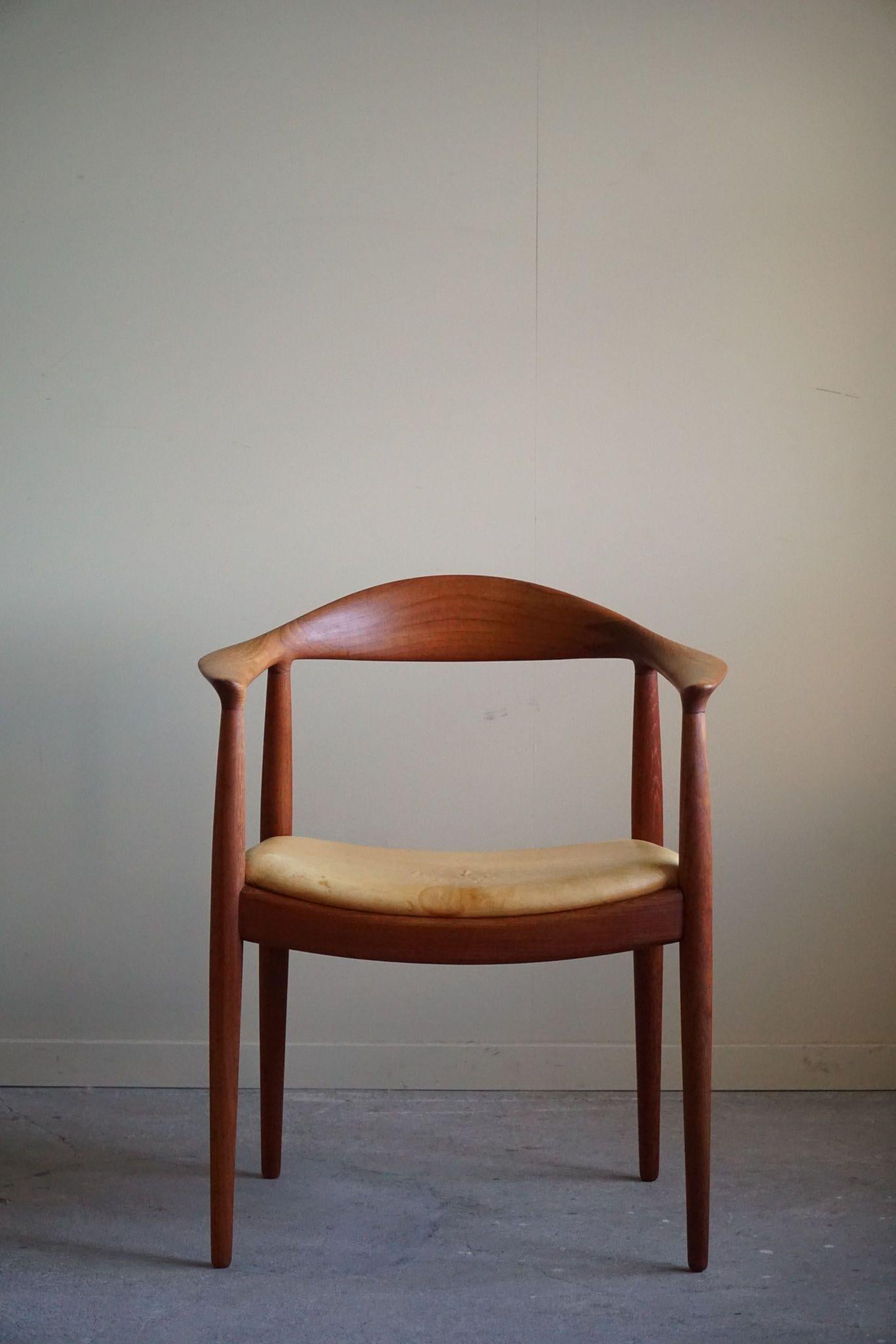 An iconic armchair in teak and leather, Model JH501, famously known as 