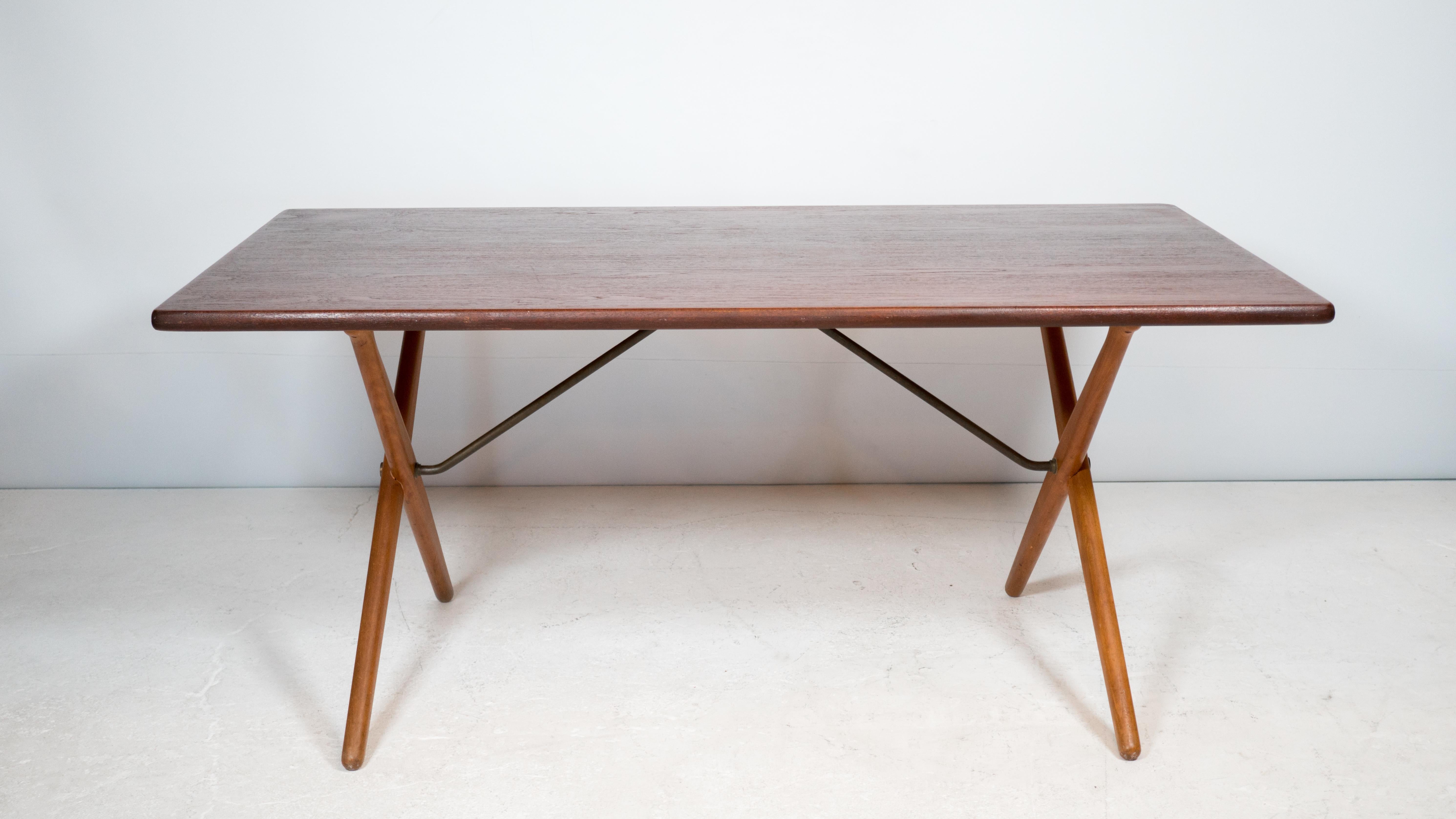 Hans Wegner 'AT-303' sawhorse table designed for Andreas Tuck, 1950s. Floating table top with tubular brass stem supporting cross-shaped legs. Minimal Scandinavian design with focus on form and function. Suitable usage as a desk. Good vintage