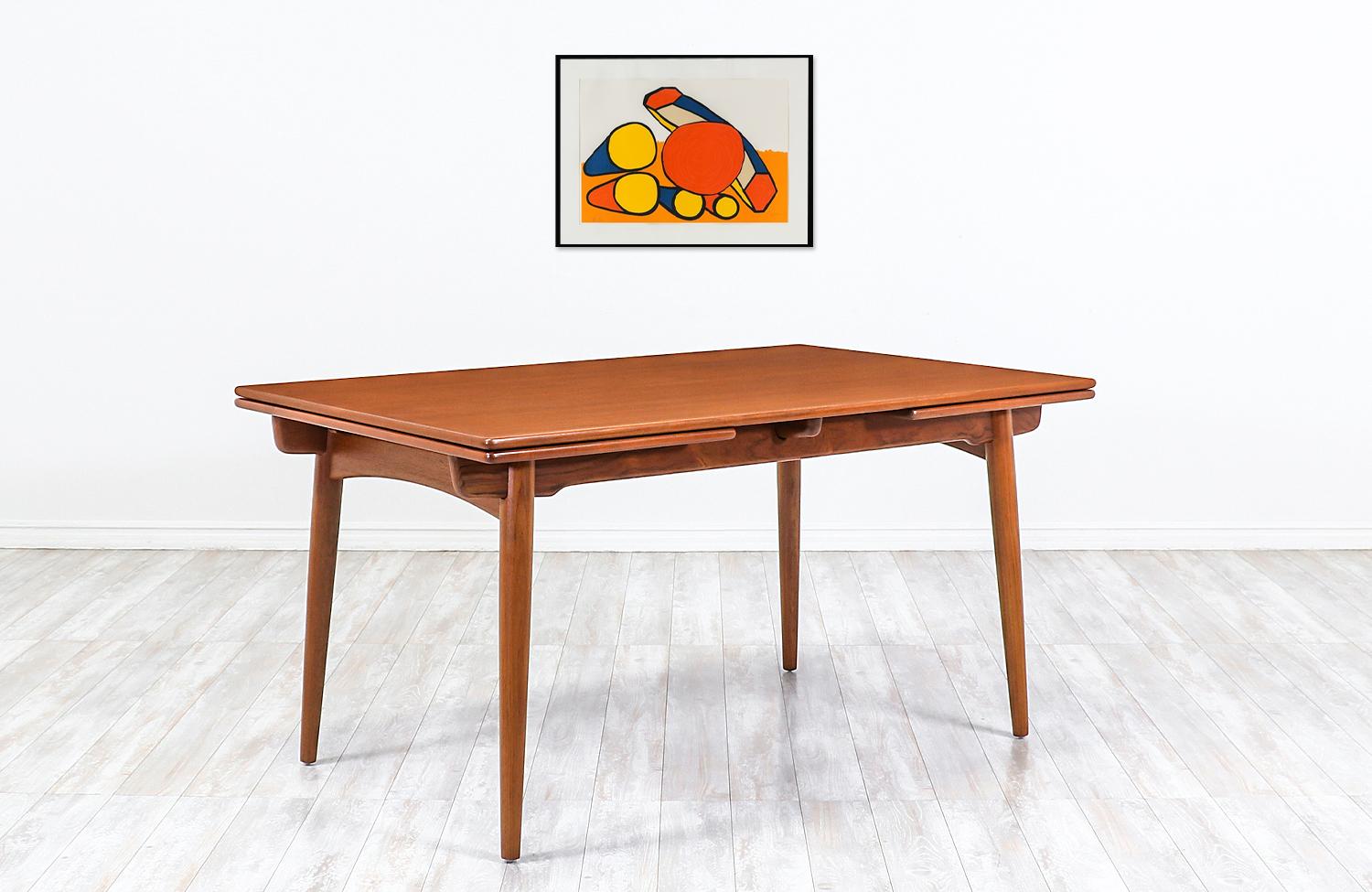 Hans J. Wegner AT 312 teak draw-leaf dining table for Andreas Tuck


Dimensions:
28.50in H x 55in W - 94in W x 35.50in D
Each extension leaf 19.50in.