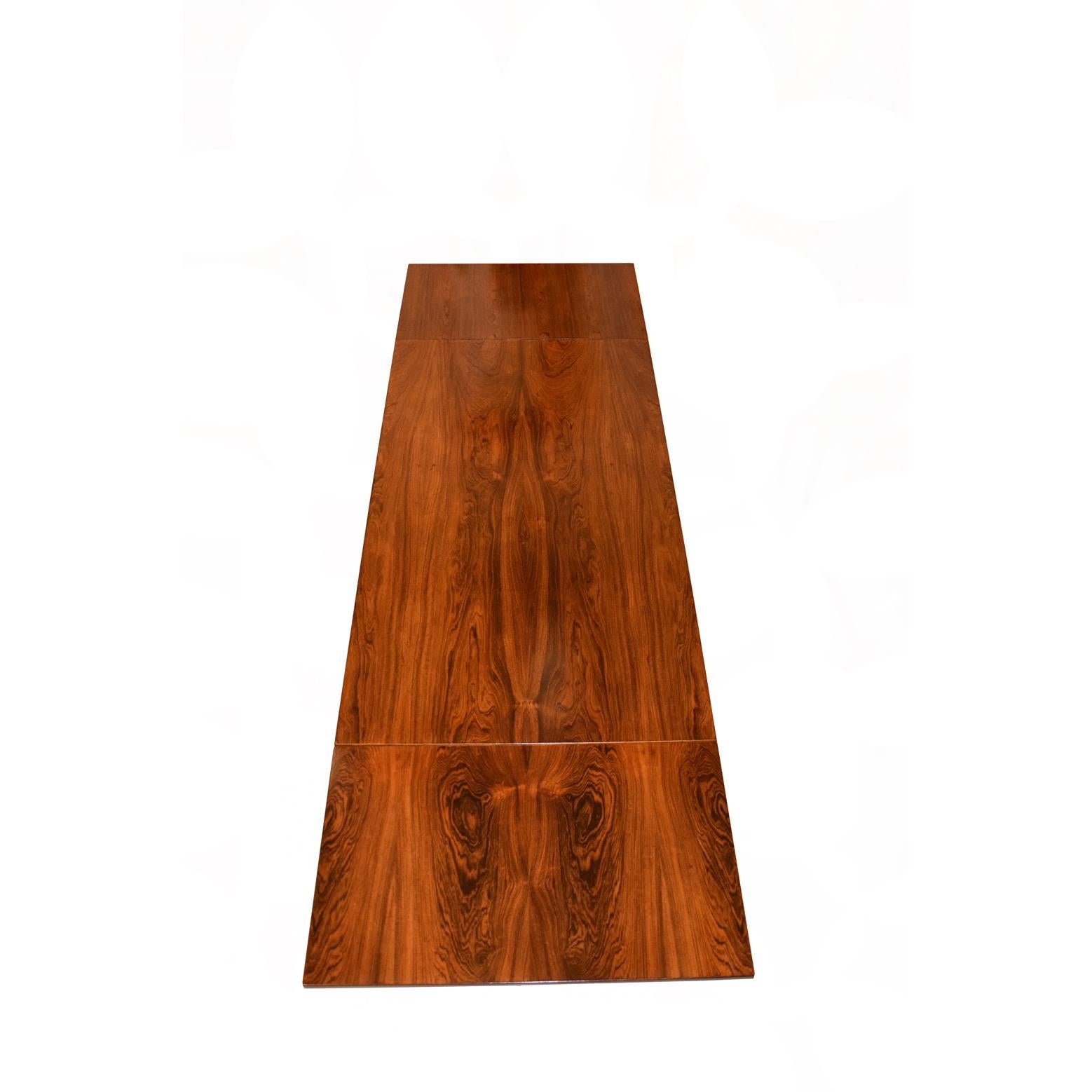 Rosewood dining table with removable drop leaves mede by Andreas Tuck can be used as working table fully extends to 120.5