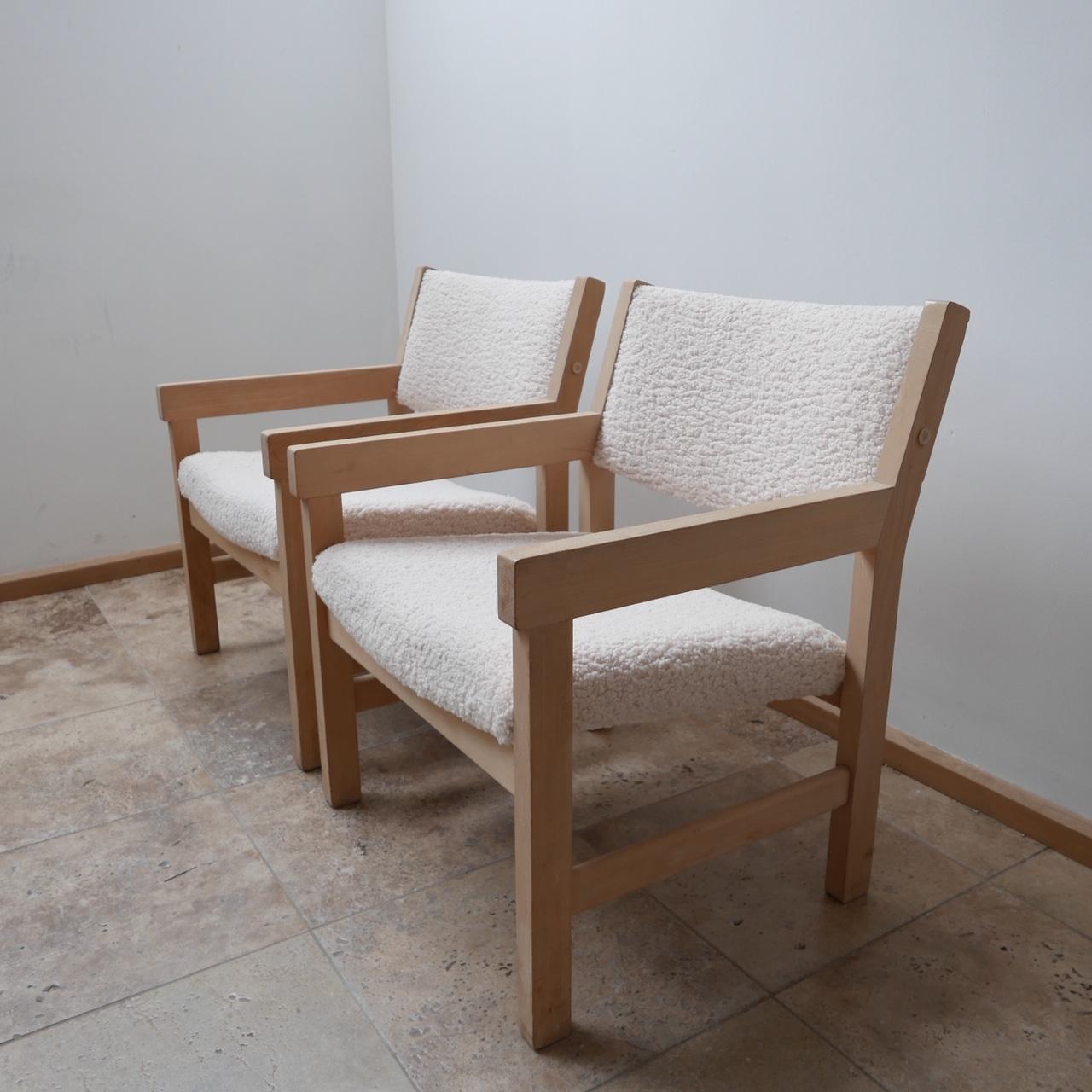 A pair of Hans J Wegner armchairs. 

Denmark, c1960s. 

Re-upholstered in thick boucle like fabric akin to sheepskin. 

Comfy and stylish. 

Price is for the pair. 

Very good condition. 

Dimensions: 62 W x 62 D x 42 seat height x 74