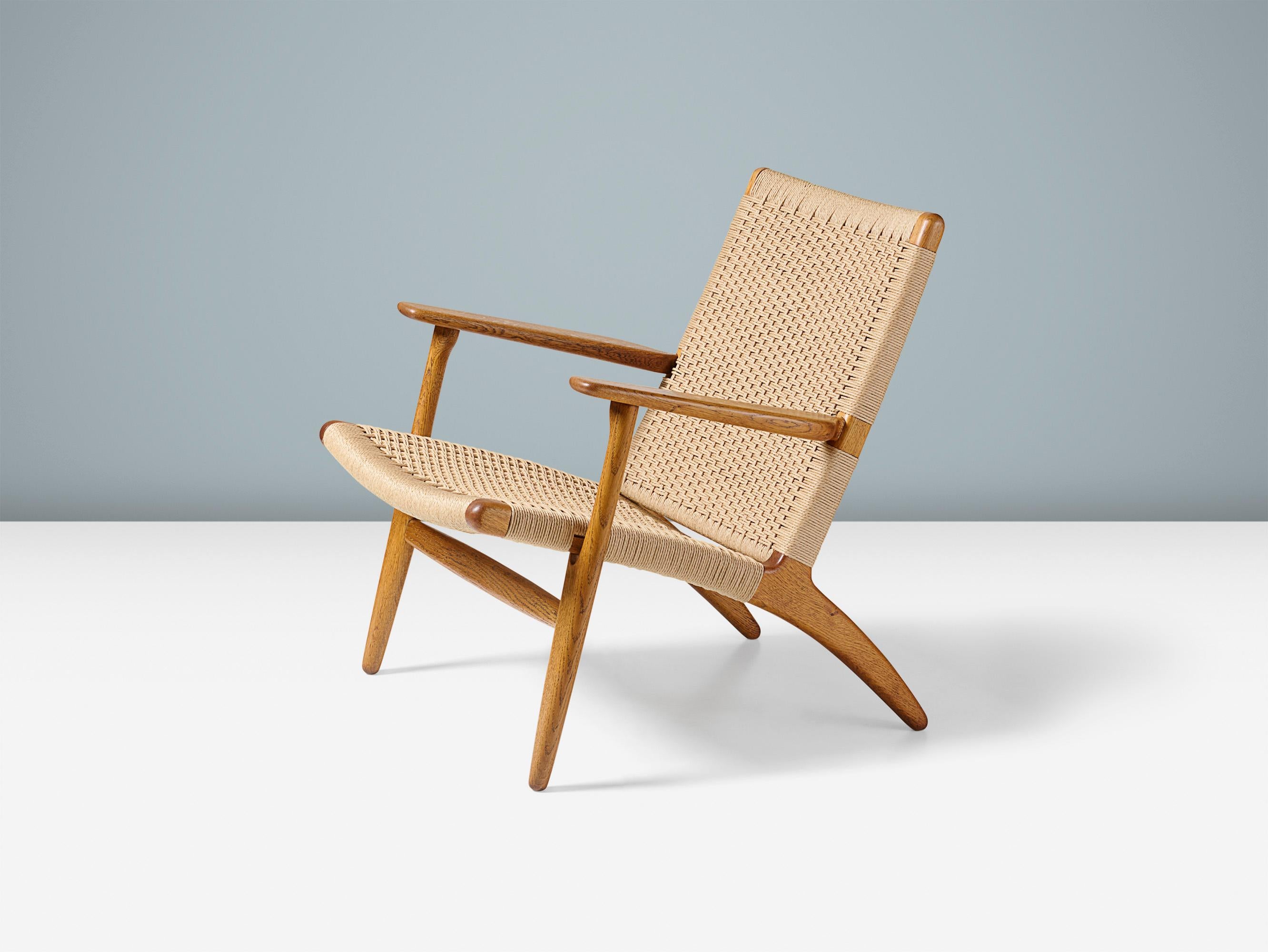 Hans J. Wegner - CH-25 Lounge Chair, 1950

Produced by Carl Hansen & Son, Copenhagen, Denmark. Oiled, patinated oak frame with new woven paper cord seat and back. 

This is an early example of this iconic design in fantastic condition. 

Measures: H