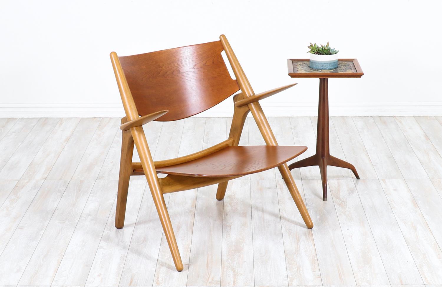 Hans J. Wegner CH-28 chair for Carl Hansen & Søn

Dimensions
30.5oin H x 28.50in W x 27in D
Seat Height 15in.