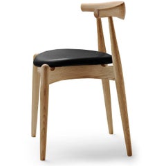 Chaise 'CH20' de Hans J. Wegner en Oak, cuir noir et huile pour Carl Hansen & Son