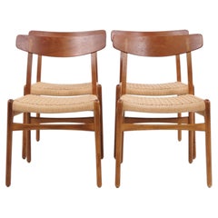 Sillas de comedor CH23 de Hans J. Wegner, con respaldo de teca y asiento trenzado, de Carl Hans