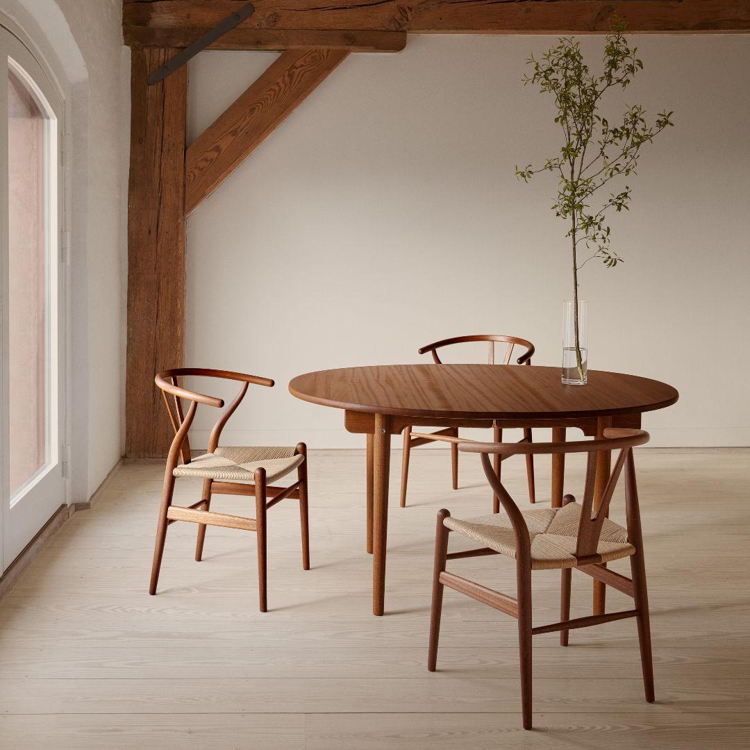 Hans J. Wegner 'CH24 Wishbone' chair in mahogany and oil for Carl Hansen & Son

The story of Danish Modern begins in 1908 when Carl Hansen opened his first workshop. His firm commitment to beauty, comfort, refinement, and craftsmanship is evident