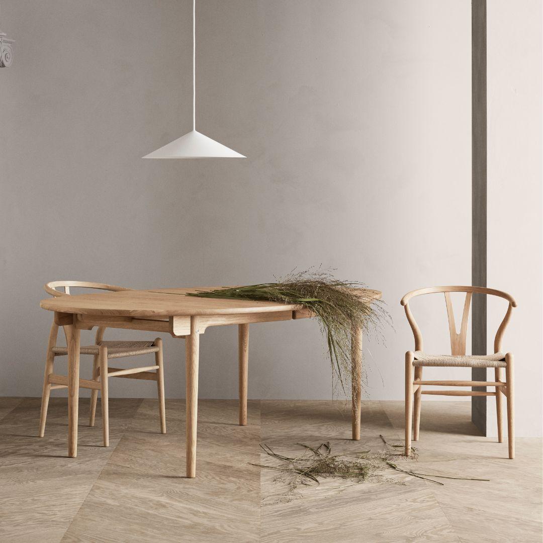 Hans J. Wegner 'CH24 Wishbone' chair in oak & white oil for Carl Hansen & Son

The story of Danish Modern begins in 1908 when Carl Hansen opened his first workshop. His firm commitment to beauty, comfort, refinement, and craftsmanship is evident