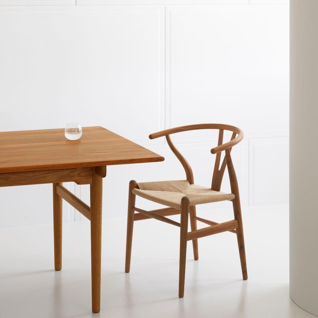Hans J. Wegner 'CH24 Wishbone' chair in teak and oil for Carl Hansen & Son

The story of Danish Modern begins in 1908 when Carl Hansen opened his first workshop. His firm commitment to beauty, comfort, refinement, and craftsmanship is evident in
