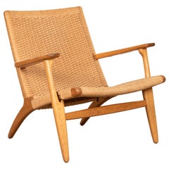 Hans J. Wegner Chaise longue CH25 en chêne et cordon naturel pour Carl Hansen & Søn