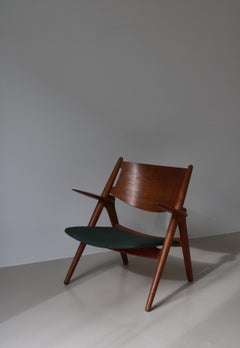 Hans J. Wegner "Sawbuck" Lounge Chair in Patinated Oak, 1950s