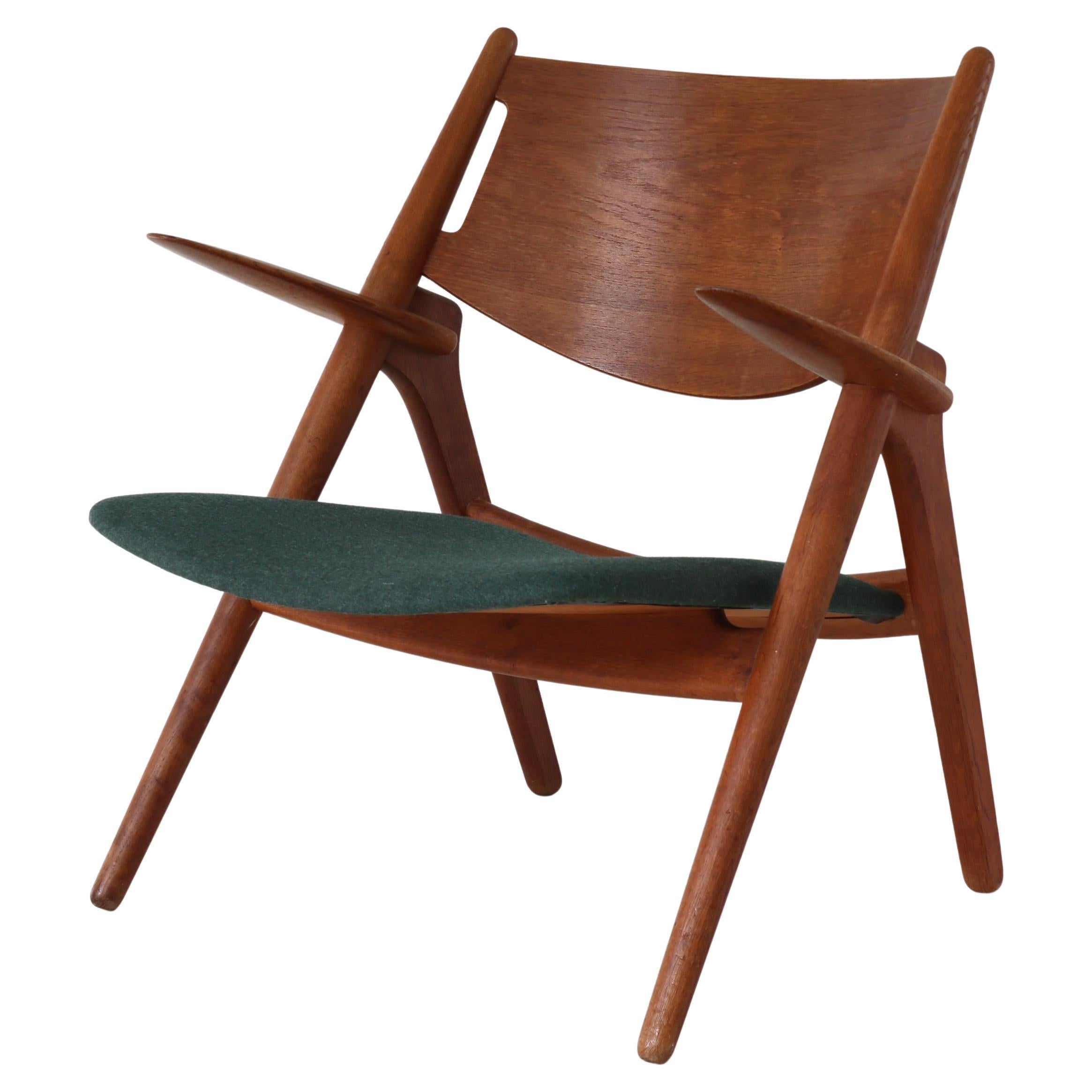 Hans J. Wegner "CH28" Lounge Chair in Patinated Oak, Carl Hansen & Sons, 1950s For Sale