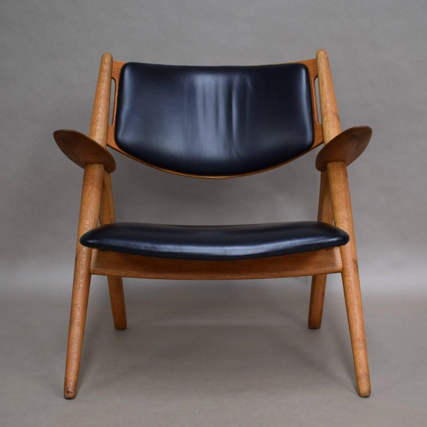 CH28 Sawbuck lounge chairs by Hans J. Wegner for Carl Hansen and Son, Denmark.
Two chairs available.

Manufacturer: Carl Hansen and Son

Designer: Hans J. Wegner

Country: Denmark

Model: CH-28 Sawbuck lounge chair

Material: Teak / oak /