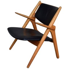 Hans J. Wegner CH28 Sawbuck Lounge Chair, Denmark, circa 1950