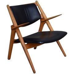 Hans J. Wegner CH28 Sawbuck Lounge Chair, Denmark, circa 1950