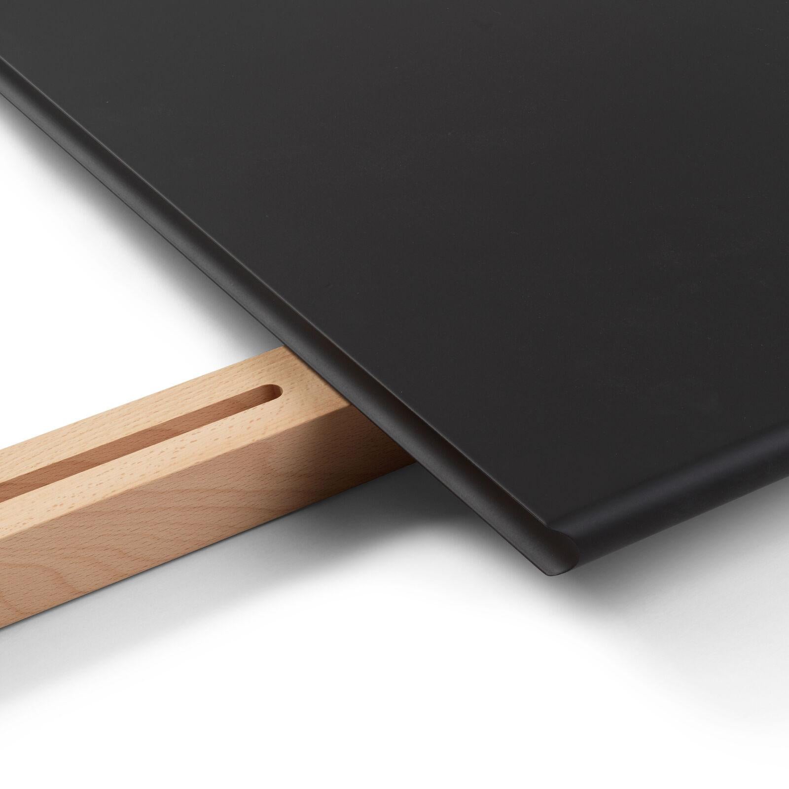 The CH327T insert leaf for Hans J. Wegner’s CH327 dining table extends the elegant design of the original table. Crafted from black MDF, the leaf maintains the table’s clean lines and refined proportions while providing extra surface area for