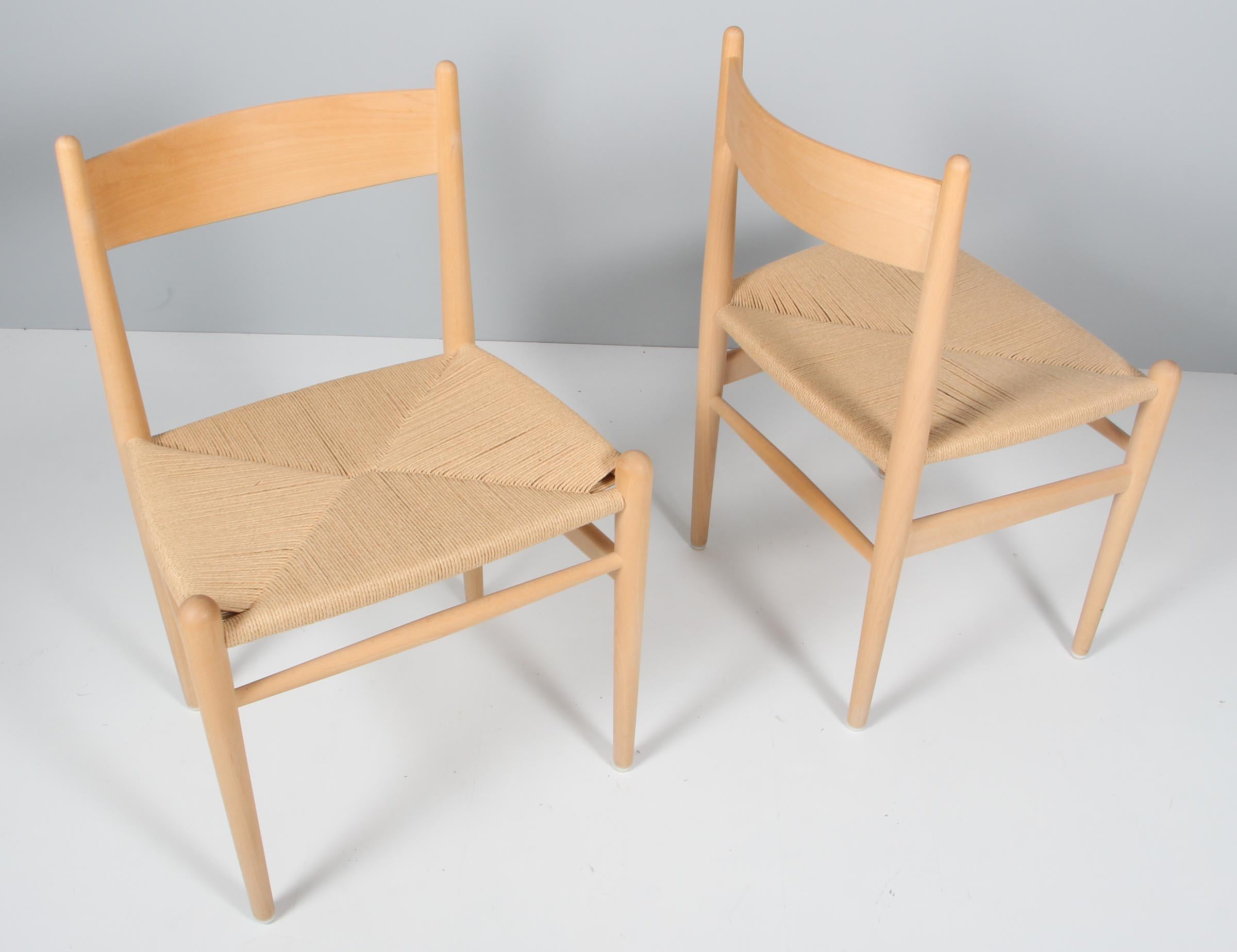 Hans J. Wegner dining chairs in solid soap treated beach, original papercord seat. 

Model CH36, made by Carl Hansen.