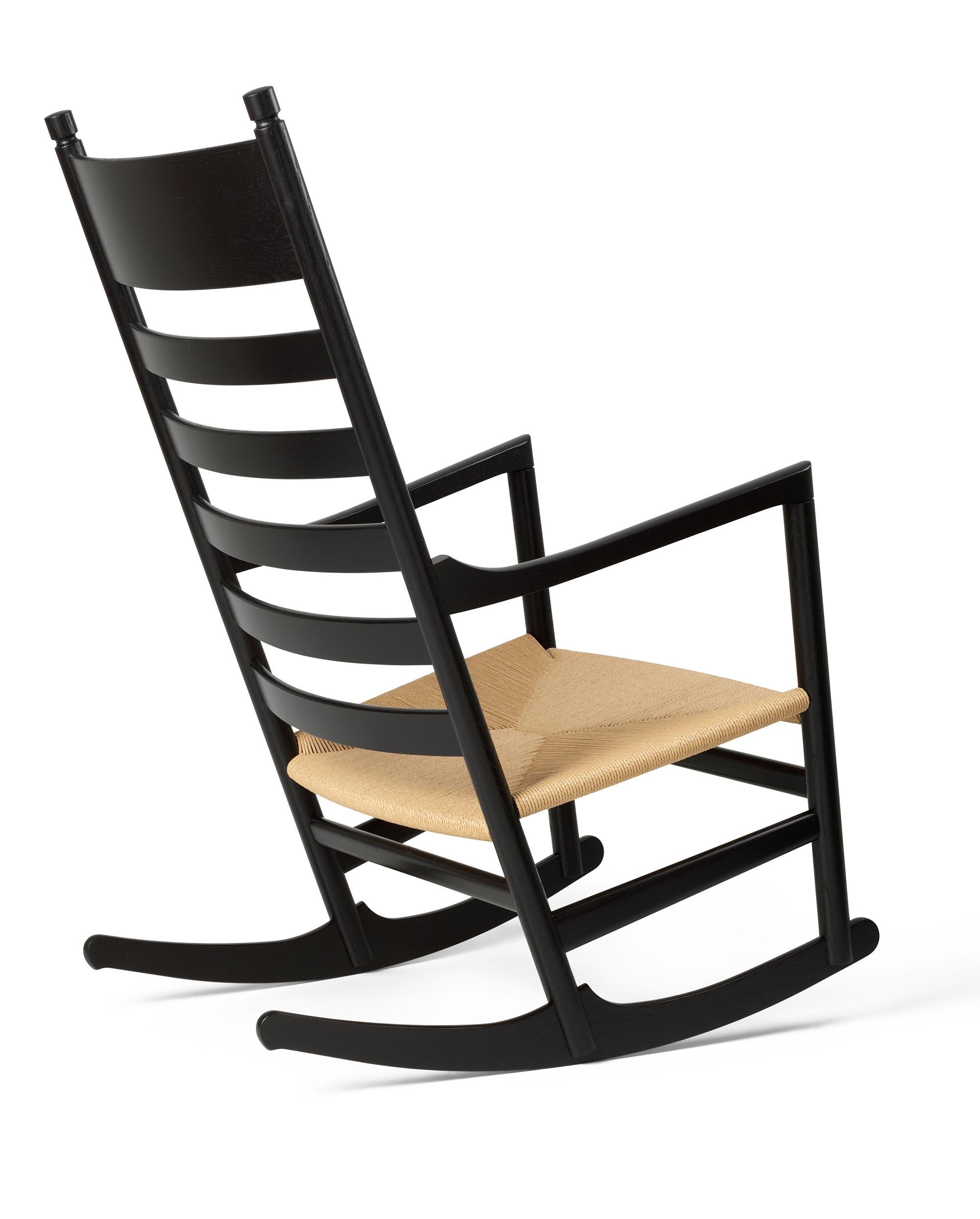 Hans J. Wegner 'CH45' Rocking Chair for Carl Hansen & Son in Black.

The story of Danish Modern begins in 1908 when Carl Hansen opened his first workshop. His firm commitment to beauty, comfort, refinement, and craftsmanship is evident in iconic