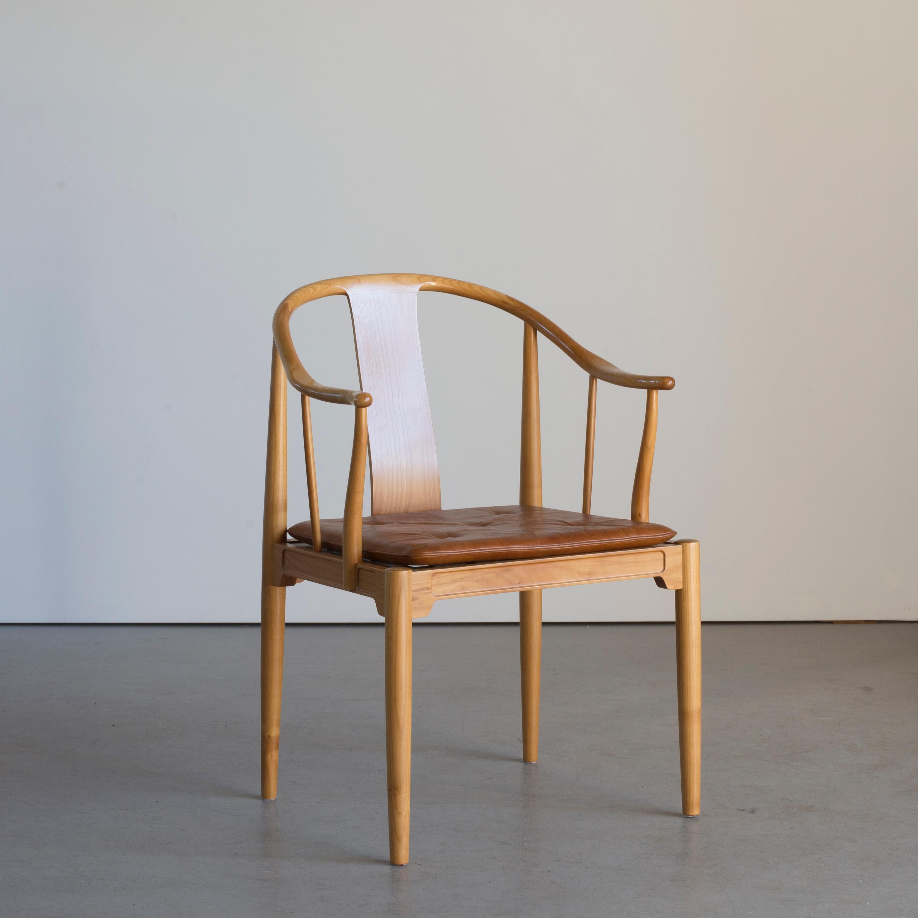 Chinese chair by Hans J. Wegner, 1944. Executed by Fritz Hansen, 1980.

Cherrywood and leather cushion.