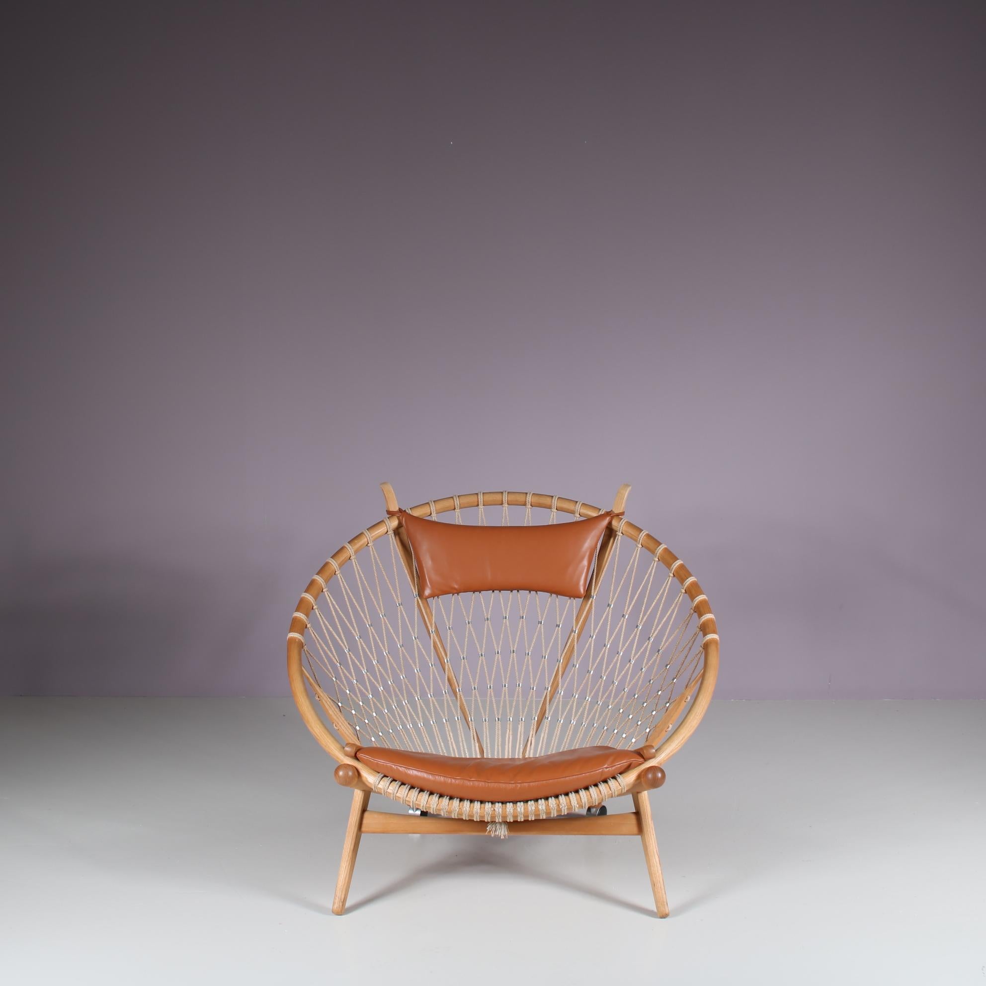 A truly iconic “Circle Chair”, model PP130, designed by Hans J. Wegner and manufactured by PP Mobler in Denmark around 1980.

This remarkable chair is made of the highest quality oak wood with a unique rope structure creating the support for seat