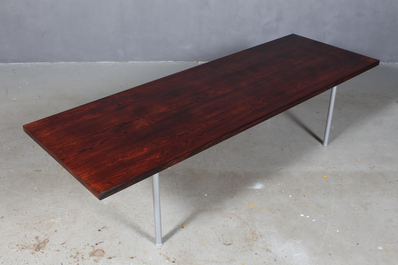 Hans J. Wegner coffee table, veneered with rosewood.

Frame of brushed steel.

1960s, Denmark. 

Made by Andreas Tuck.
   