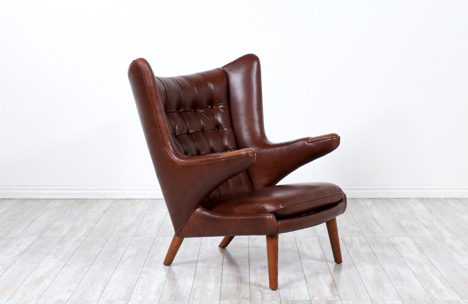 This iconic “Papa Bear” lounge chair were designed by Hans J. Wegner for the famous Danish workshop of A.P. Stolen in 1951. Originally named the AP-19, this model acquired the name “Papa Bear” when a journalist claimed that the chair looked like a