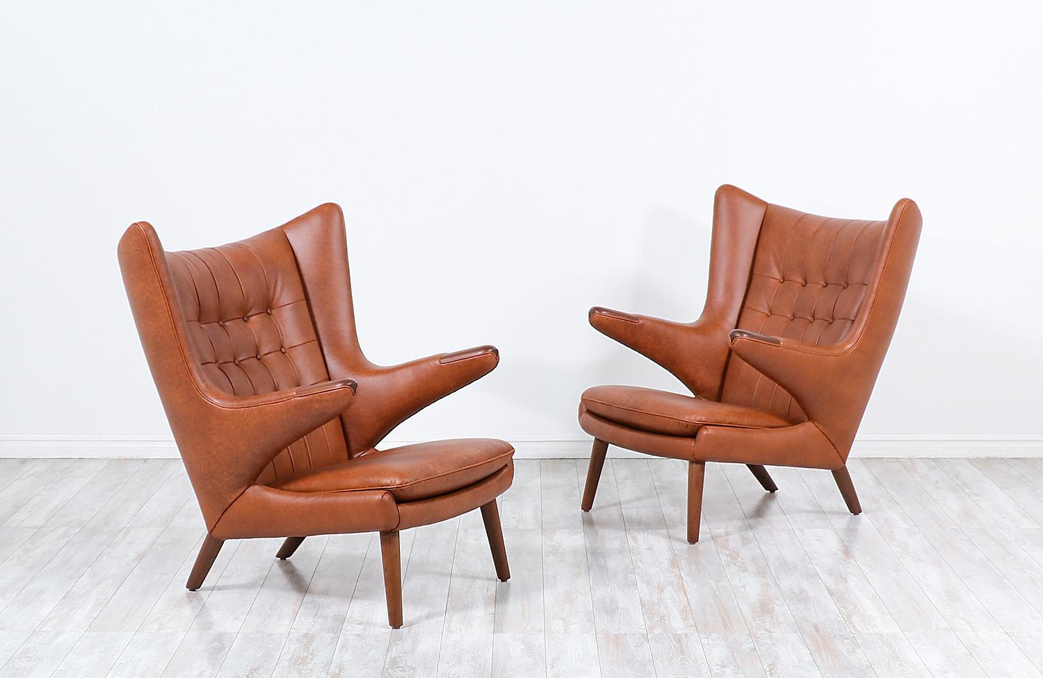 These iconic “Papa Bear” lounge chairs were designed by Hans J. Wegner for the famous Danish workshop of A.P. Stolen in 1951. Originally named the AP-19, this model acquired the name “Papa Bear” when a journalist claimed that the chair looked like a