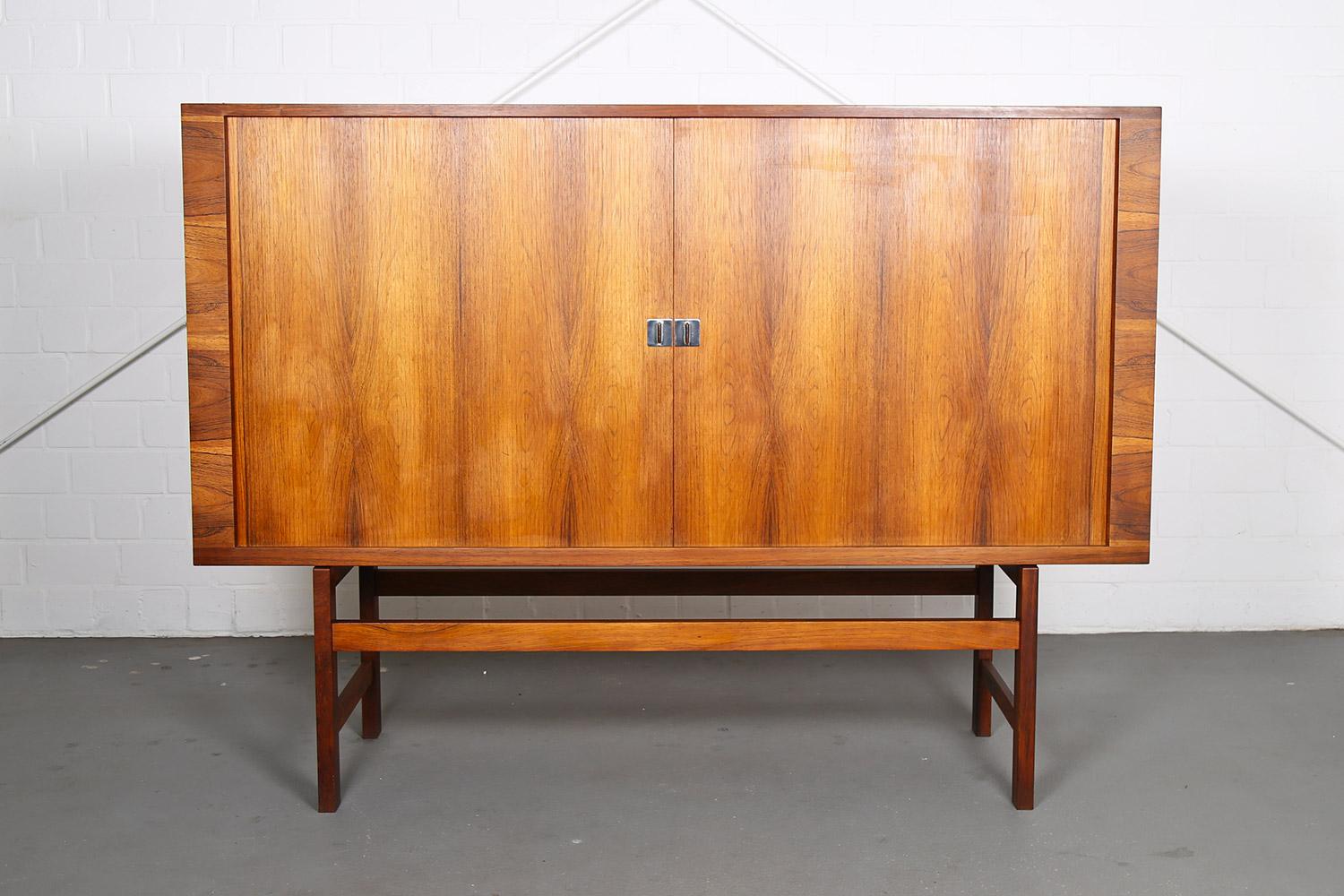Rare Highboard designed by Hans J. Wegner model “RY-45” for Ry Møbler in the 60s. Also known as the “President Credenza”. Danish Design Sideboard in beautiful rosewood version with wooden legs.
