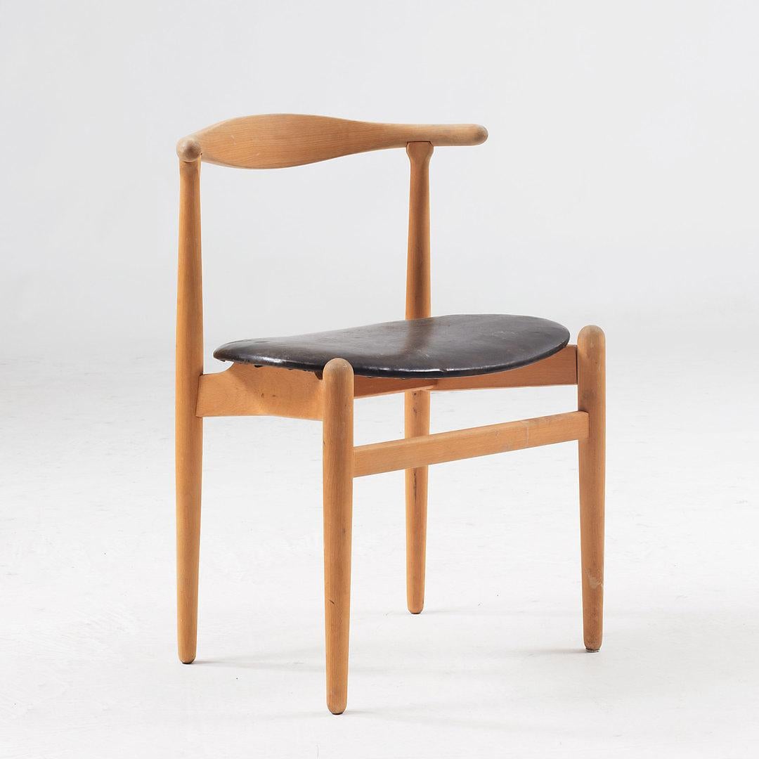 Hans Wegner, dining chairs model FH 1934, designed in Denmark in 1949. 
Solid wooden beech frame with curved backrest. There are four straight legs and the two front legs are connected via a horizontal slat. The legs slightly protrude above the