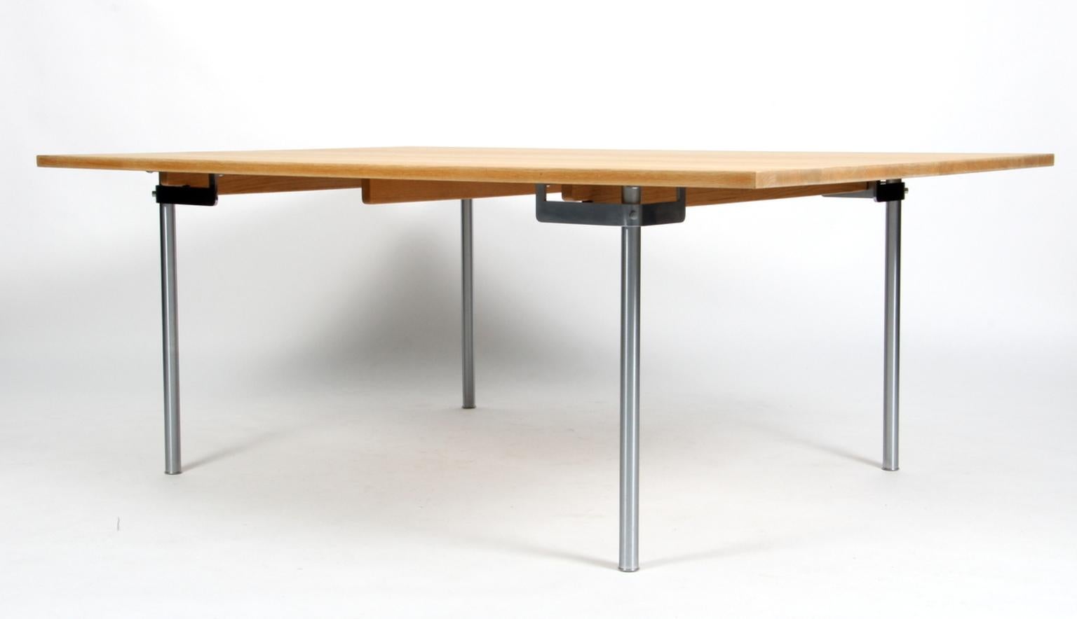 Hans J. Wegner dining table made of massive soap treated oak.

Base of brushed steel.

Model CH316, made by Tranekjær for Carl Hansen.