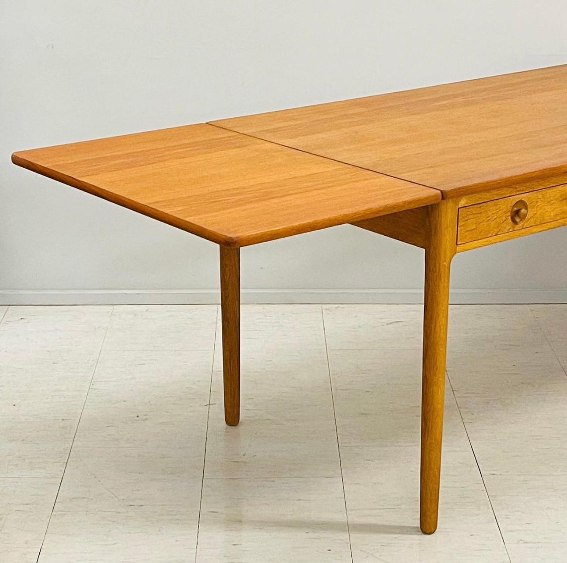 Classic Danish Modernist drop-leaf table/desk by Danish designer Hans J. Wegner can be used both as a work desk and as a dining table. The design is from 1955 and this particular table is from the early and original production by cabinetmaker