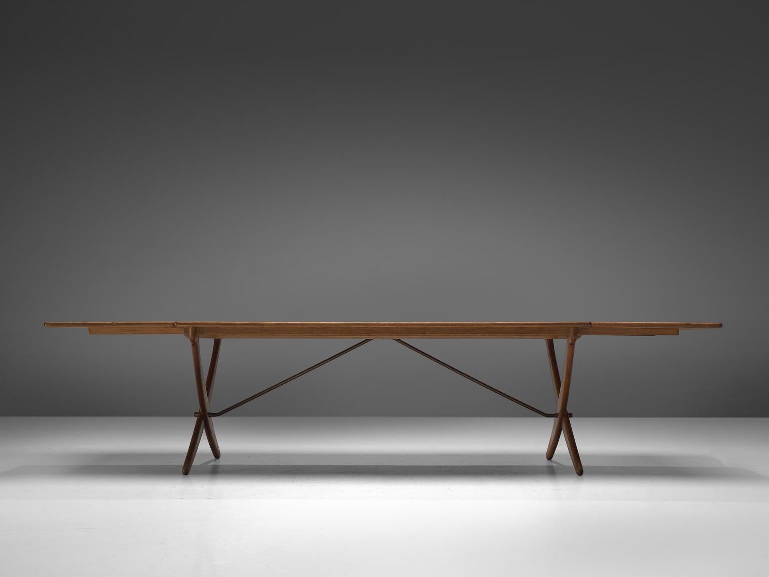 Hans J. Wegner for Andreas Tuck, table model AT-304, teak, rosewood and metal, Denmark, 1952.

Drop-leaf table with elegant X-shaped legs, by Danish Designer Hans Wegner. This table is considered as one of the best known designs from Wenger. From a