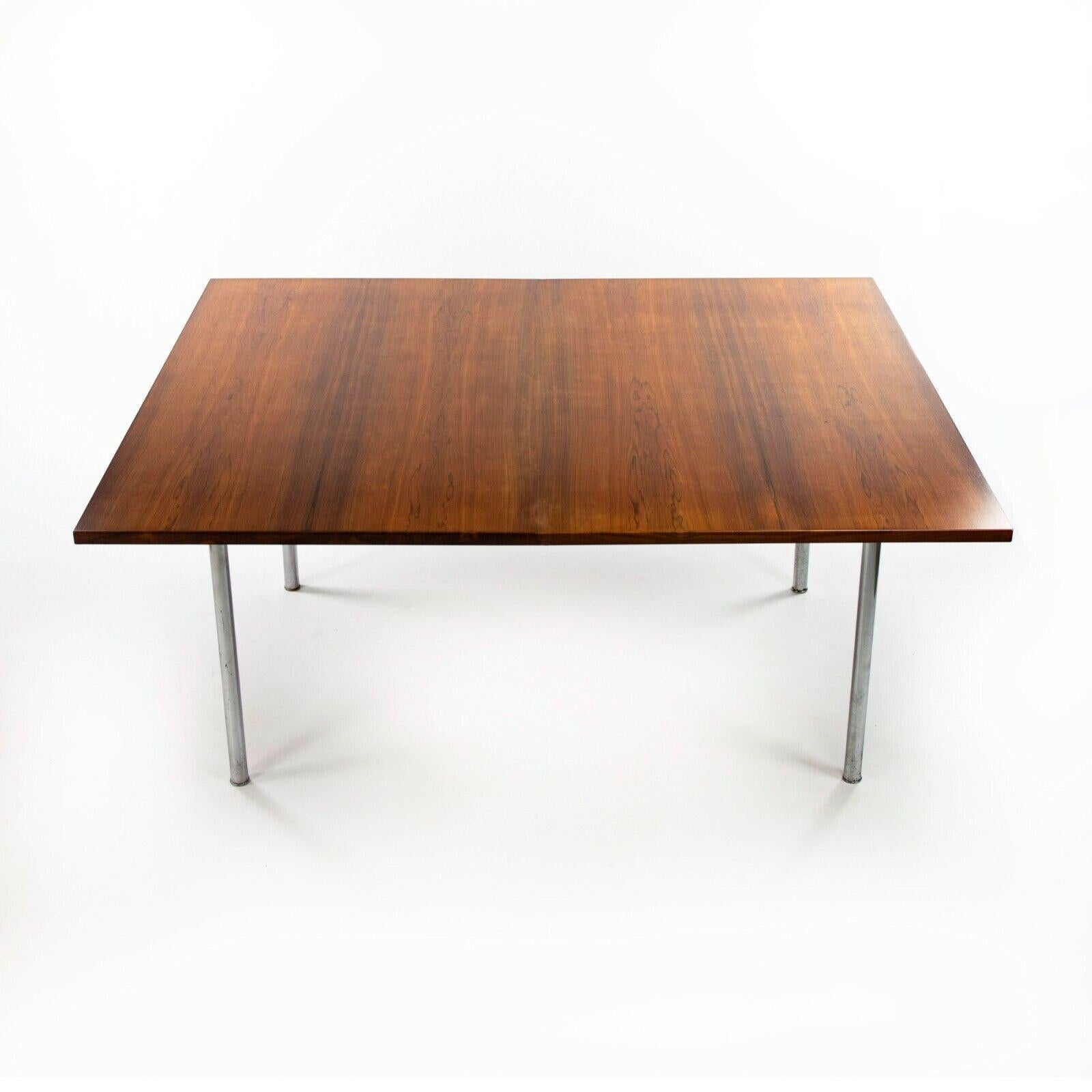 We present a rare AT321 extension dining table, designed by Hans J. Wegner and produced by Andreas Tuck circa 1960. This is one of the most luxurious table designs by Wegner in the most sought after material (Brazilian rosewood). This example has