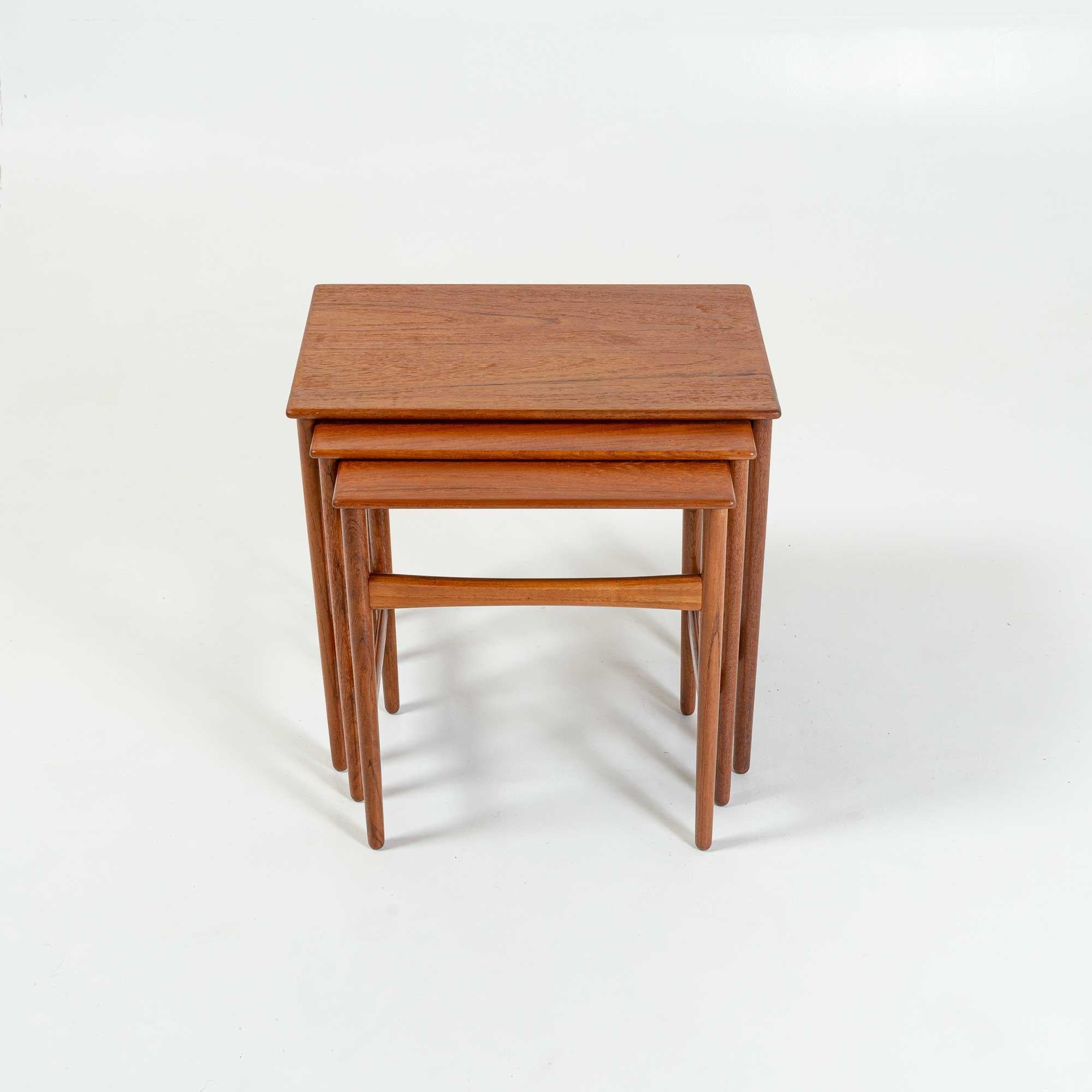 A Mid-Century Modern Classic nesting set of side Table, designed by Hans Wegner, manufactured by Andreas Tuck, Teak, 1960s. In overall good condition, has been restored ready to use.
