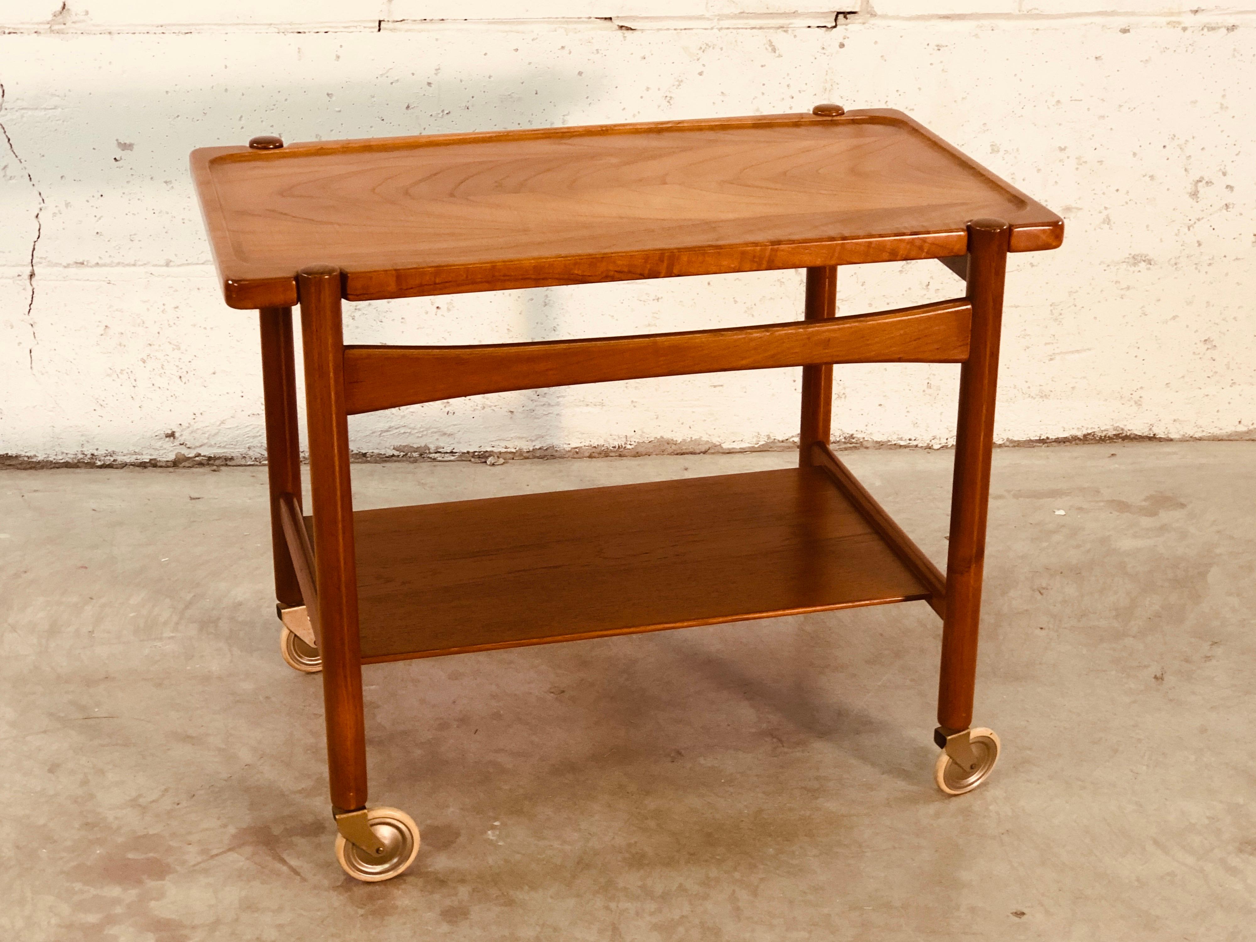 Vintage 1960s serving cart or trolley designed by Hans J. Wegner for Andreas Tuck in Denmark. The top of the cart is removable and the tray can be used to serve. Excellent condition. Fully marked.
