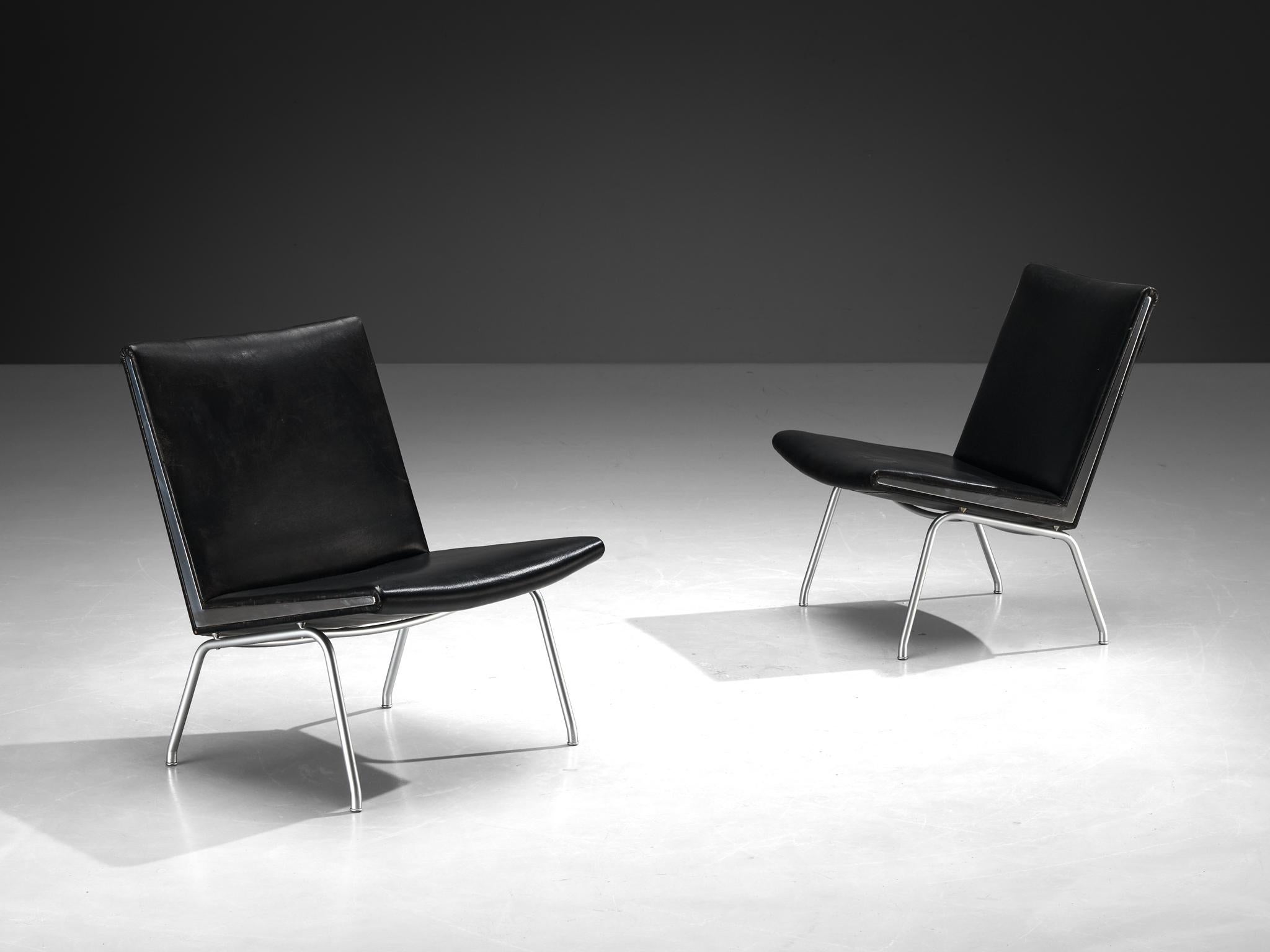 Hans J. Wegner for A.P. Stolen, pair of 'Airport' lounge chairs, leather, steel, Denmark, 1958

This pair of Airport chairs are designed by icon Hans Wegner in 1958. The design was not specifically meant to furnish airports, but is named after the