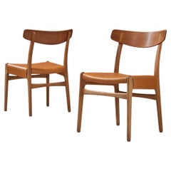 Hans J. Wegner for Carl Hansen Pair of Dining Chairs in Cognac Leather and Oak