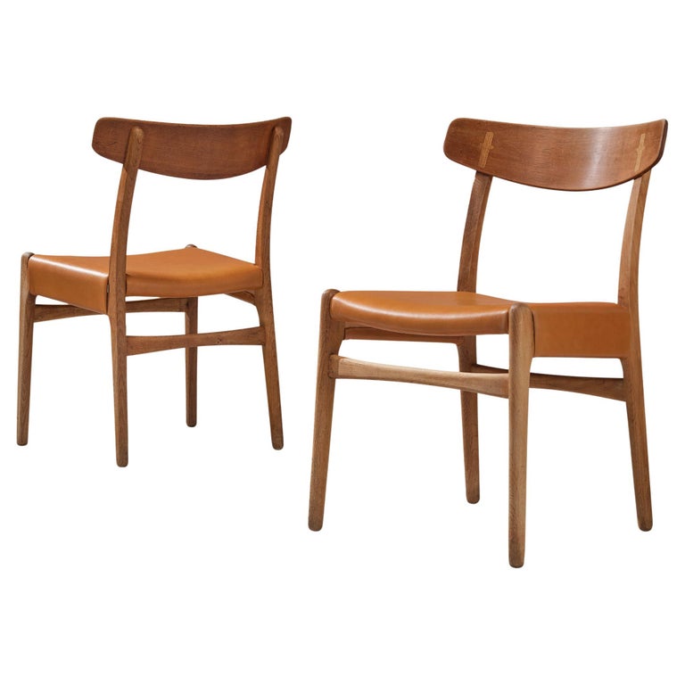 Hans J. Wegner for Carl Hansen Pair of Dining Chairs in Cognac Leather and Oak For Sale